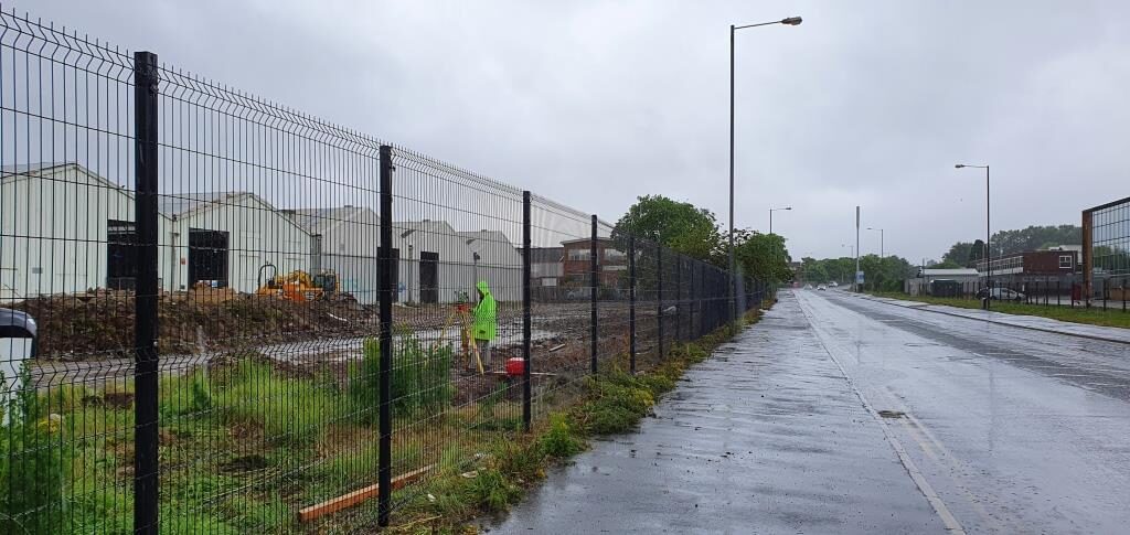 Commercial security fencing installation for perimeter protection